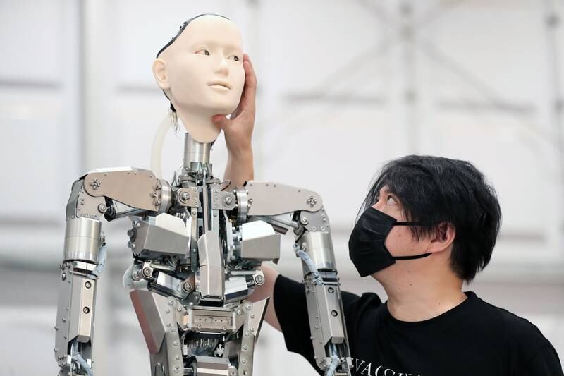 Android Opera creator Keiichiro Shibuya with one of his robot performers.