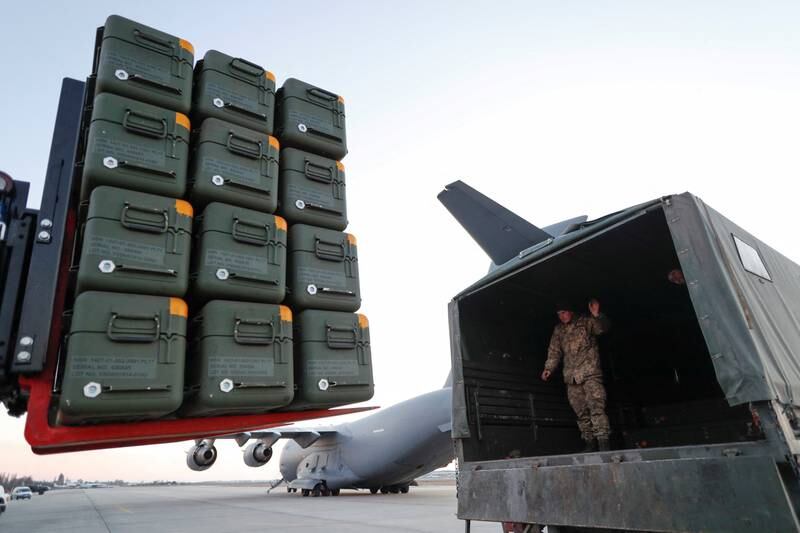 Lithuanian military aid is unloaded from a C-17 Globemaster III plane at an airport in Ukraine in February. Reuters