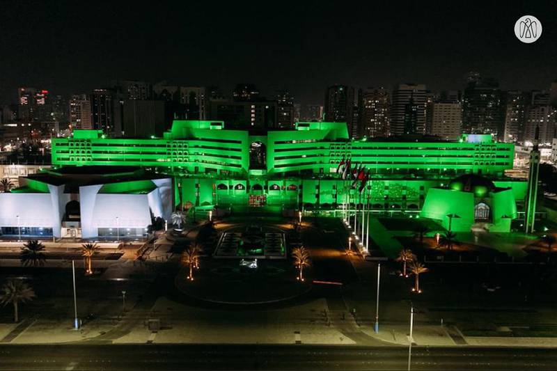 The Department of Municipalities and Transport in Abu Dhabi building glows green for Pakistan's Independence Day. More than a million Pakistani citizens call the UAE their home.