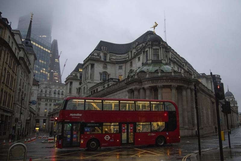 A bus passes the Bank of England in the City of London, U.K., on Monday, Feb. 15, 2021. The U.K. recorded 15 million vaccinations against the coronavirus, a milestone that is set to increase pressure on Prime Minister Boris Johnson to begin reopening the economy. Photographer: Jason Alden/Bloomberg