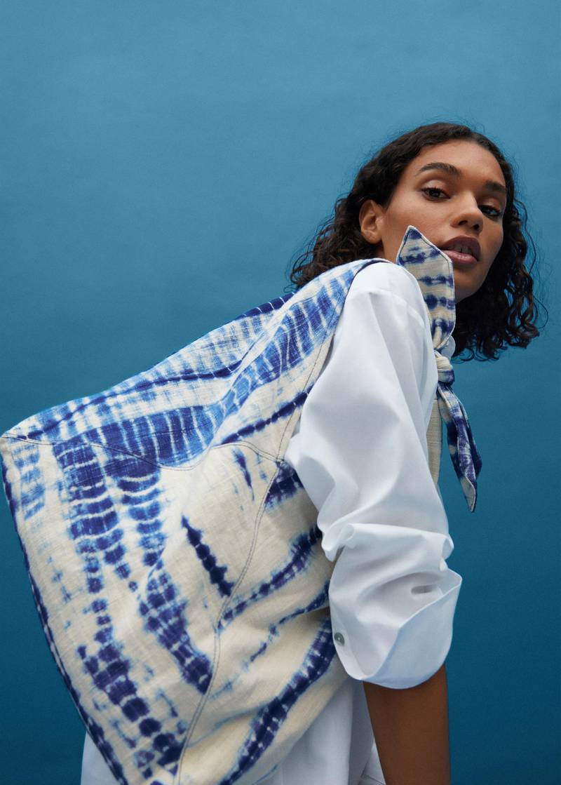 A tie-dyed bag from the H&M Upcycled Accessories collection. Courtesy H&M