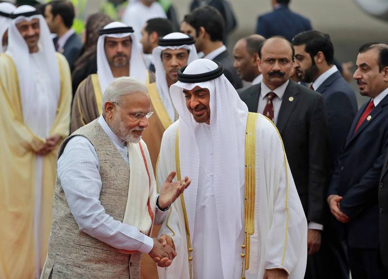 FILE - In this Jan. 24, 2017 file photo, Indian Prime Minister Narendra Modi, left, gestures as he receives Abu Dhabi's Crown Prince, Sheikh Mohammed bin Zayed Al Nahyan at the airport in New Delhi, India. Gulf Arab countries have remained mostly silent as Indiaâ€™s government moved to strip the Indian-administered sector of Kashmir of its limited autonomy, imposing a sweeping military curfew in the disputed Muslim-majority region and cutting off residents from all communication and the internet. This muted response is underwritten by more than $100 billion in annual trade with India that makes it one of the Arabian Peninsulaâ€™s most prized economic partners. (AP Photo/Manish Swarup, File)