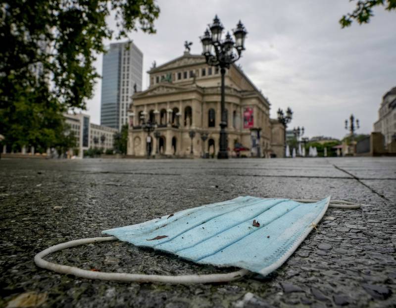 A face mask sits discarded in front of the Old Opera in Frankfurt. Germany recently banned incoming travellers from Portugal, where the Delta variant is now dominant. Only German citizens or residents are allowed in from Portugal and they must quarantine for two weeks upon arrival..