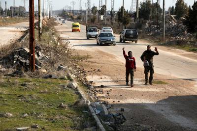 People walk as Syrian army units advance to the Aleppo Ghazi Aintab International Highway and the northern countryside of Aleppo, Syria.  EPA