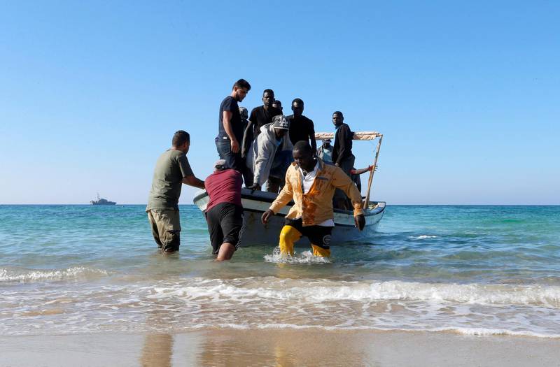 Migrants are seen after being rescued by Libyan coast guard in Tripoli, Libya. Reuters