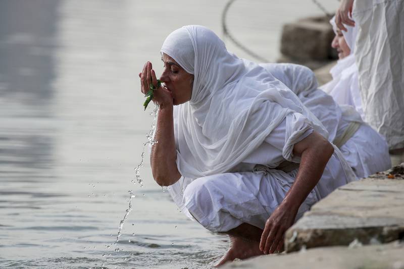 A woman from the Sabea Mandaean community during the Prosperity Day celebration in the Tigris River in central Baghdad, Iraq.  AP