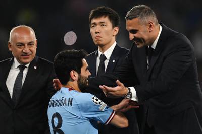 Manchester City chairman Khaldoon Al Mubarak embraces Manchester City's German midfielder Ilkay Gundogan after the team's 1-0 victory over Inter Milan to win the Champions League for the first time in the club's history. AFP