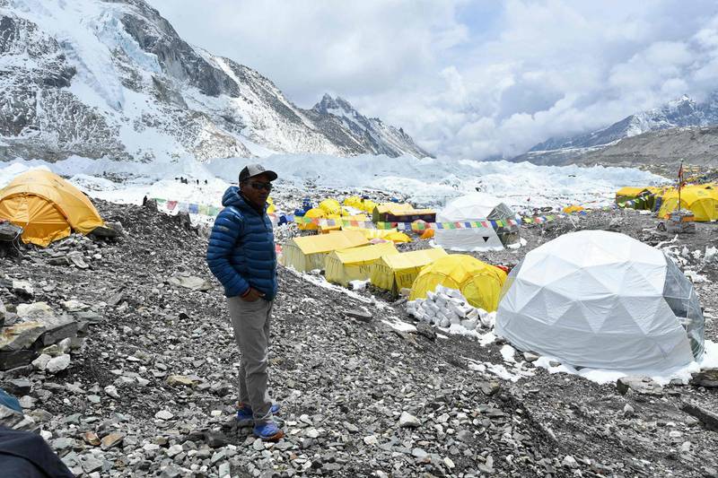 Rita stands at base camp before the record-breaking rope-fixing summit begins on Mount Everest. AFP