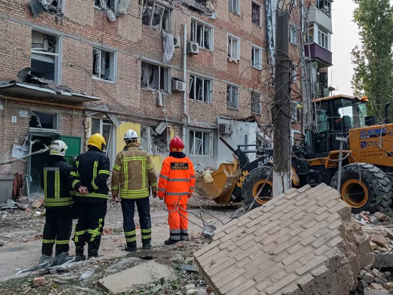 Rescuers at the site of an apartment building in Mykolaiv on Thursday after it was damaged by a Russian military strike. Reuters
