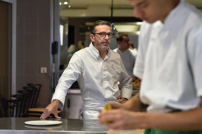 (FILES) This file photo taken on September 21, 2017 shows French chef Sebastien Bras posing in the kitchen of his three-star restaurant Le Suquet, in Laguiole, southern France, after announcing that he asked not to be included in the Michelin Guide starting in 2018.
Sebastien Bras, chef of the three-star restaurant Le Suquet, announced on September 20, 2017, he asked not to be included in the Michelin Guide starting in 2018, to ease off on such a pressure. The upcoming 2018 Michelin guide will be umveiled on February 5, 2018. / AFP PHOTO / REMY GABALDA