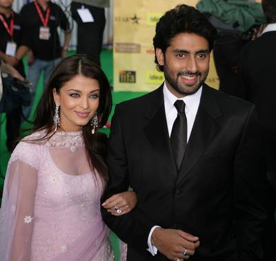 SHEFFIELD, UNITED KINGDOM - JUNE 09:  Bollywood actor Abhishek Bachchan and his wife Aishwarya Rai arrive at the International Indian Film Academy Awards (IIFAs) at the Sheffield Hallam Arena on June 9, 2007 in Sheffield, England.   (Photo by Christopher Furlong/Getty Images)