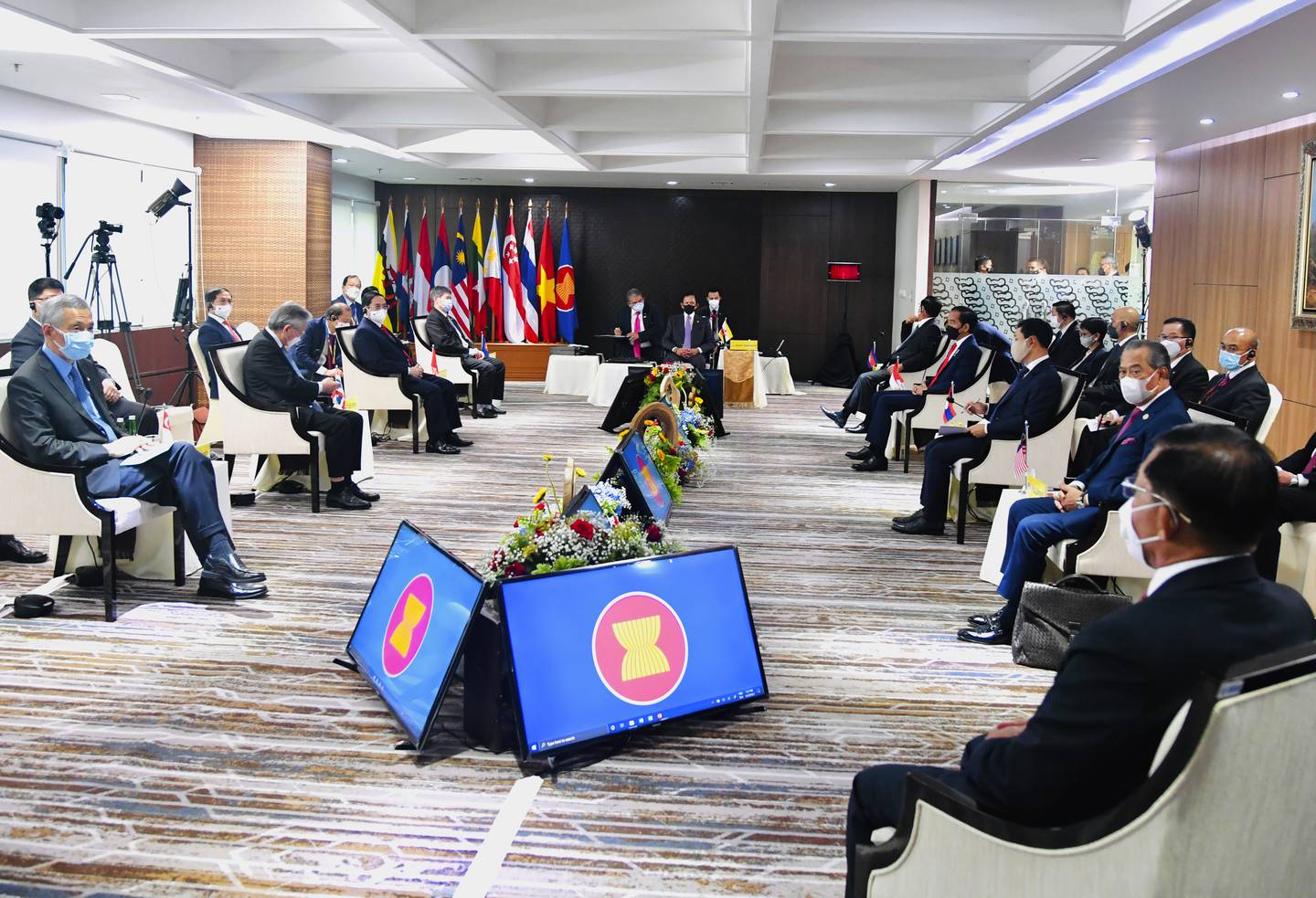 In this photo released by Indonesian Presidential Palace, Myanmar's Commander-in-Chief Senior General Min Aung Hlaing, bottom right, and ASEAN leaders convene during their meeting at the ASEAN Secretariat in Jakarta, Indonesia, Saturday, April 24, 2021. Southeast Asian leaders met Myanmar's top general and coup leader in an emergency summit in Indonesia Saturday, and are expected to press calls for an end to violence by security forces that has left hundreds of protesters dead as well as the release of Aung San Suu Kyi and other political detainees. (Laily Rachev, Indonesian Presidential Palace via AP)