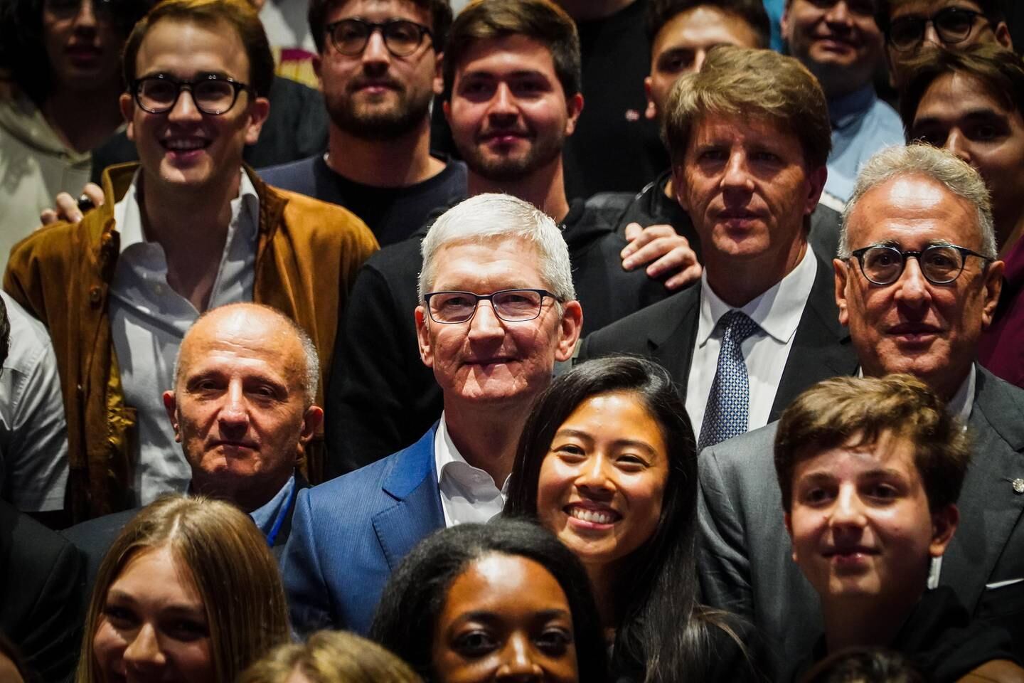 Apple’s chief executive Tim Cook (in blue jacket). EPA