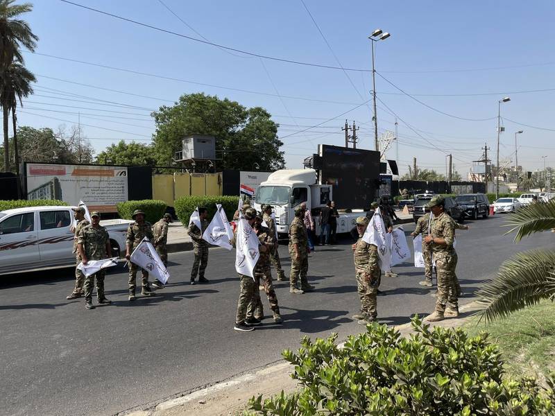 PMF fighters and supporters are preparing for the funeral procession near Baghdad’s fortified Green Zone for four fighters killed in Monday’s US air strikes along Iraq-Syria border. Sinan S. Mahmoud / The National