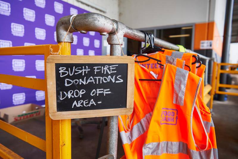 A sign shows the public where to unload donated goods at the Food Bank Distribution Centre bound for areas impacted by  bushfires in the Glendenning suburb of Sydney, Australia. Getty Images