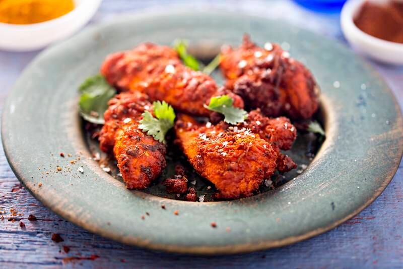 Chicken tandoori is a healthier option when compared with the cream-heavy butter chicken. Photo: Getty Images