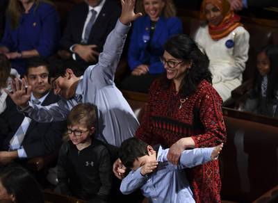 Member-elect Rashida Tlaib(D-MI) plays with her children during the 116th Congress and swearing-in ceremony on the floor of the US House of Representatives at the US Capitol.
 AFP