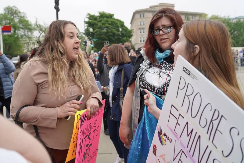 A pro-life protester squares off with two pro-choice demonstrators. Willy Lowry / The National