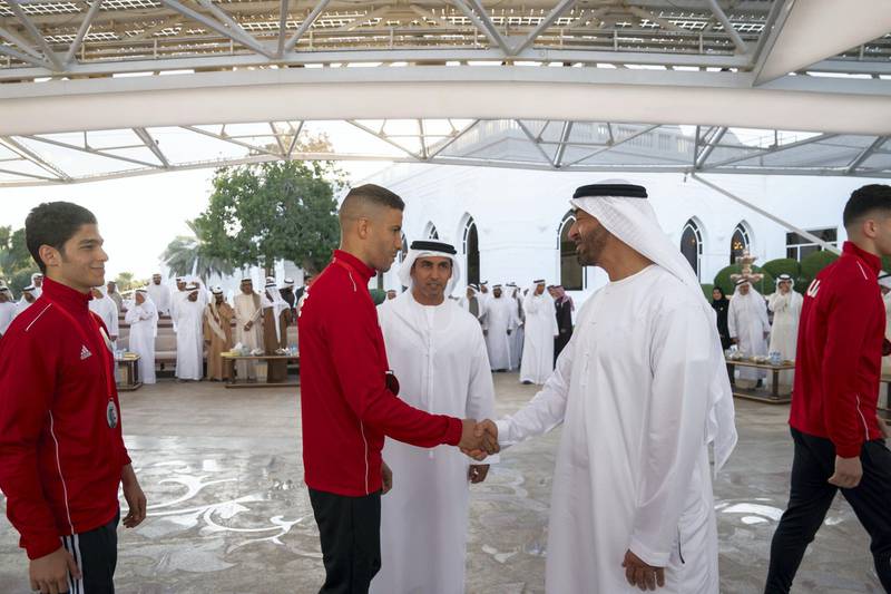 ABU DHABI, UNITED ARAB EMIRATES - December 23, 2019: HH Sheikh Mohamed bin Zayed Al Nahyan, Crown Prince of Abu Dhabi and Deputy Supreme Commander of the UAE Armed Forces (2nd R) greets a member of Asian Muay Thai Championship 2019, during a Sea Palace barza.

( Mohamed Al Hammadi / Ministry of Presidential Affairs )
---