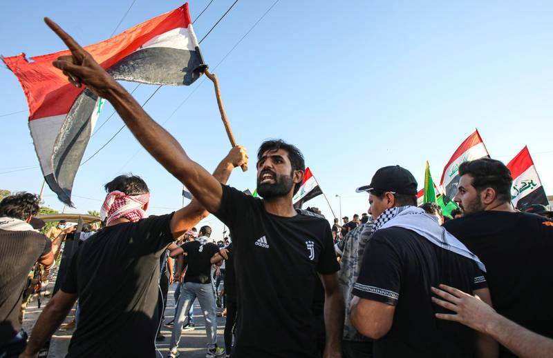Anti-government protesters gather outside the provincial council building during protests demanding free elections and against corruption in Basra, Iraq. AP Photo