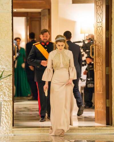 Princess Beatrice wore a champagne satin gown by Lebanese designer Reem Acra for the evening reception. PA