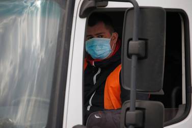 A truck driver arrives at an Amazon logistics centre in northern France on Thursday. Several hundred employees protested in France, calling on the US e-commerce giant to halt operations or make it easier for employees to stay away during the coronavirus pandemic. Photo: Reuters