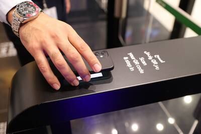 The store uses artificial intelligence and new technology to improve the retail experience. People can scan the bar code on their phone to enter Carrefour City+. Pawan Singh / The National