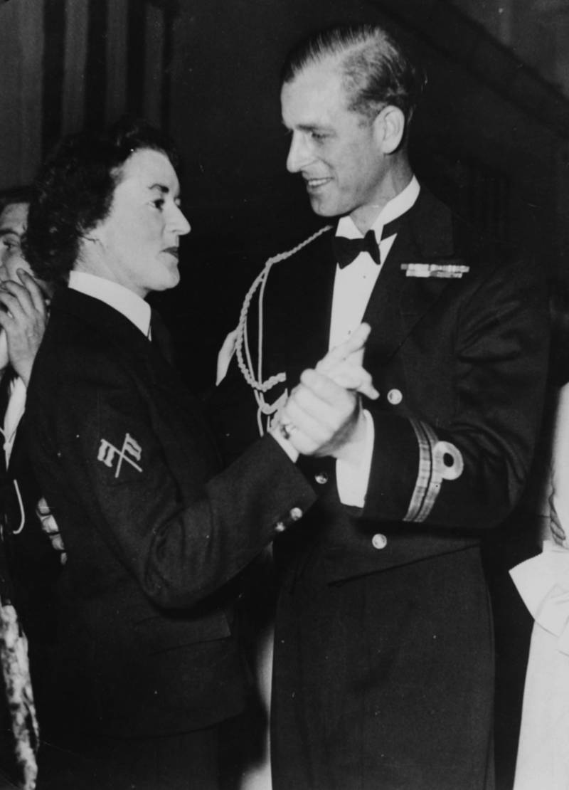 Prince Philip, the Duke of Edinburgh, dancing with Wren (Women's Royal Naval Service) Petty Officer Patricia Kelly aboard the HMS Chequers, November 27th 1949. (Photo by Central Press/Hulton Archive/Getty Images)