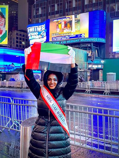 Debanjali Kamstra, the first Mrs UAE World, waves the UAE flag in the middle of Times Square in New York City, as she begins her journey to the US for the pageant. Photo: Debanjali Kamstra