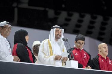 ABU DHABI, UNITED ARAB EMIRATES - March 14, 2019: HH Sheikh Mohamed bin Zayed Al Nahyan, Crown Prince of Abu Dhabi and Deputy Supreme Commander of the UAE Armed Forces (3rd L), delivers a speech during the opening ceremony of the Special Olympics World Games Abu Dhabi 2019, at Zayed Sports City. Seen with HE Mohamed Al Junaibi, Director of the President's Protocol Office at the UAE Ministry of Presidential Affairs and Chairman of the Special olympics Higher Committee (L). ( Ryan Carter / Ministry of Presidential Affairs ) ---