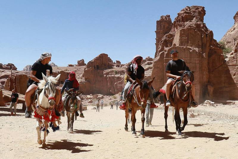 Horse and donkey rides are popular with tourists to the ancient city of Petra in Jordan. The site reopened in May after closure because of the coronavirus pandemic. AFP