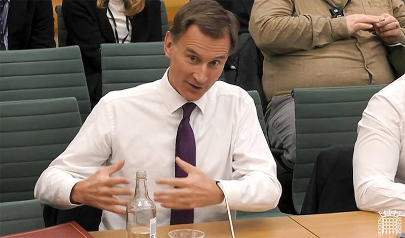 Britain's Chancellor Jeremy Hunt speaks to the Commons Treasury Committee about the autumn budget. AFP