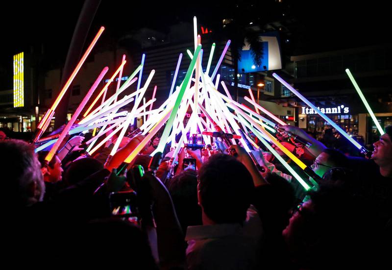 Star Wars enthusiasts huddle with their lightsabers after participating in Earth Hour at Taguig City, Philippines. Reuters