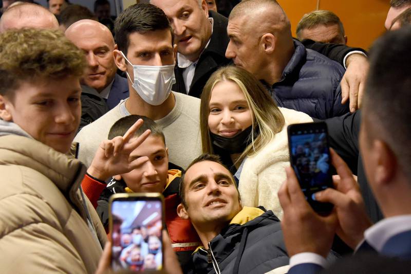 Novak Djokovic poses for photographs with fans in Budva. AFP