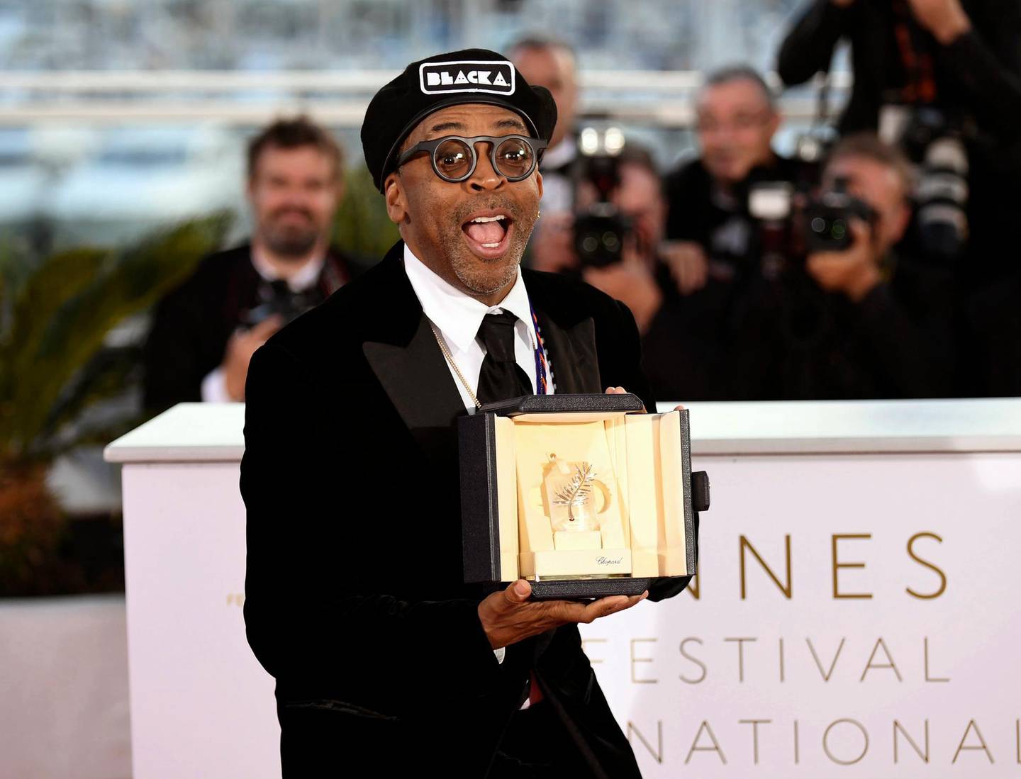 FILE - In this May 19, 2018 file photo, director Spike Lee holds the Grand Prix award for the film "BlackKklansman" following the awards ceremony at the 71st international film festival, Cannes, southern France.  Lee is releasing his film this weekend, a year after the violent clashes in Charlottesville in which anti-racism activist Heather Heyer was run over and killed. Leeâ€™s film is about an earlier chapter in white supremacism and the Ku Klux Klan: when African-American police detective Ron Stallworth infiltrated a Colorado Springs, Colorado, chapter of the KKK in 1979.  (Photo by Arthur Mola/Invision/AP, File)