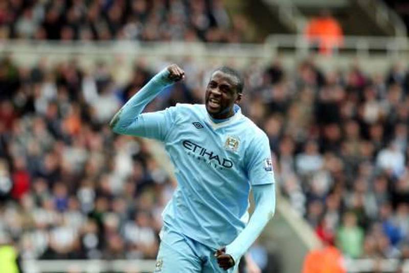 Manchester City's Yaya Toure, celebrates scoring his goal during their English Premier League soccer match against Newcastle United at the Sports Direct Arena, Newcastle, England, Sunday, May 6, 2012. (AP Photo/Scott Heppell) *** Local Caption ***  Britain Soccer Premier League.JPEG-02a28.jpg