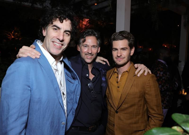 Sacha Baron Cohen, Joel Lubin and Andrew Garfield at the CAA pre-Oscar party.