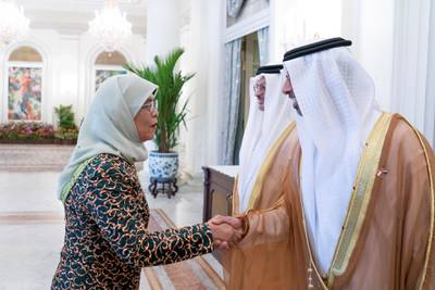 SINGAPORE, SINGAPORE - February 28, 2019: HE Halimah Yacob, President of Singapore (L), greets HE Suhail bin Mohamed Faraj Faris Al Mazrouei, UAE Minister of Energy (R), prior to a meeting, at the Istana presidential palace.
 ( Mohamed Al Hammadi / Ministry of Presidential Affairs )
—