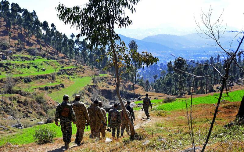 Pakistani soldiers patrol in the area where Indian planes were reportedly shot down by Pakistani forces in Jaba, near Balakot, Pakistan. AP Photo