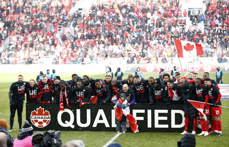 Canada celebrate after beating Jamaica to qualify for the 2022 World Cup. AFP