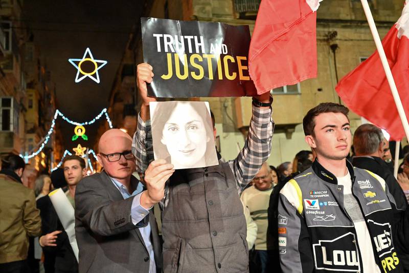 In this photo taken December 3, 2019, protesters gather outside police headquarters in Valletta after the family of murdered Maltese anti-corruption journalist Daphne Caruana Galizia called for continued demonstrations on her behalf.
