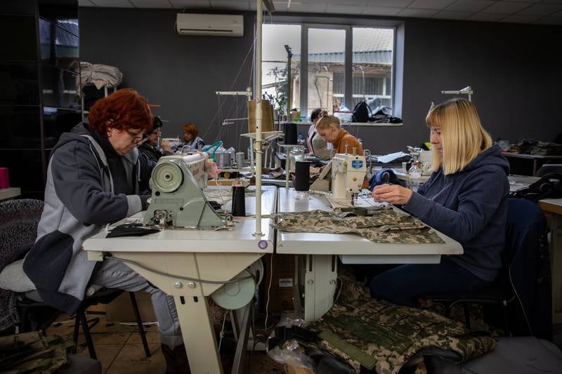 Women sew camouflage fabric for homemade military bullet proof vests and flak jackets in Mykolaiv on March 31. Oliver Marsden for the National