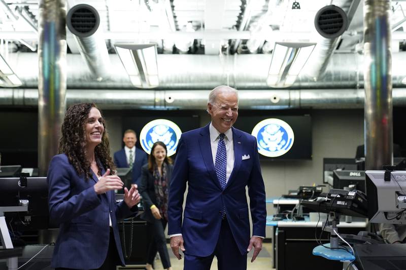 President Joe Biden talks with Christine Abizaid, director of the National Counter-terrorism Centre, during a visit to McLean, Virginia. AP