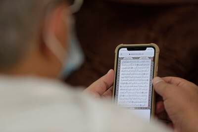A pilgrim recites the Quran.