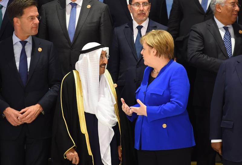 Germany's Chancellor Angela Merkel  talks with Emir of Kuwait Sheikh Sabah Al Ahmad Al Sabah. AFP