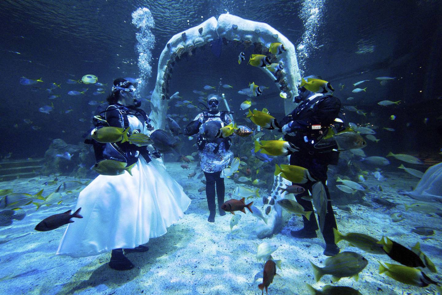 Lisa Huggins, left and Chris Jackson during their underwater wedding ceremony at Bear Grylls Adventure, in Birmingham. AP Photo