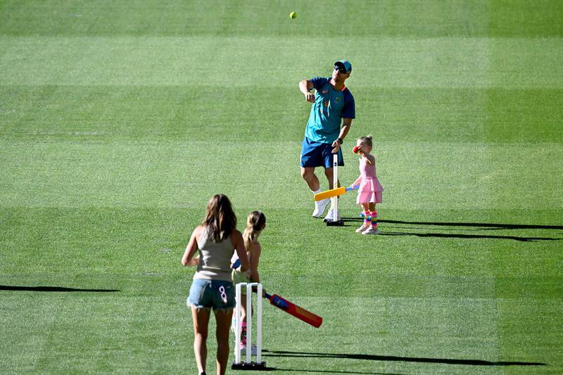 Australia's David Warner plays with his family at the Melbourne Cricket Ground. AFP