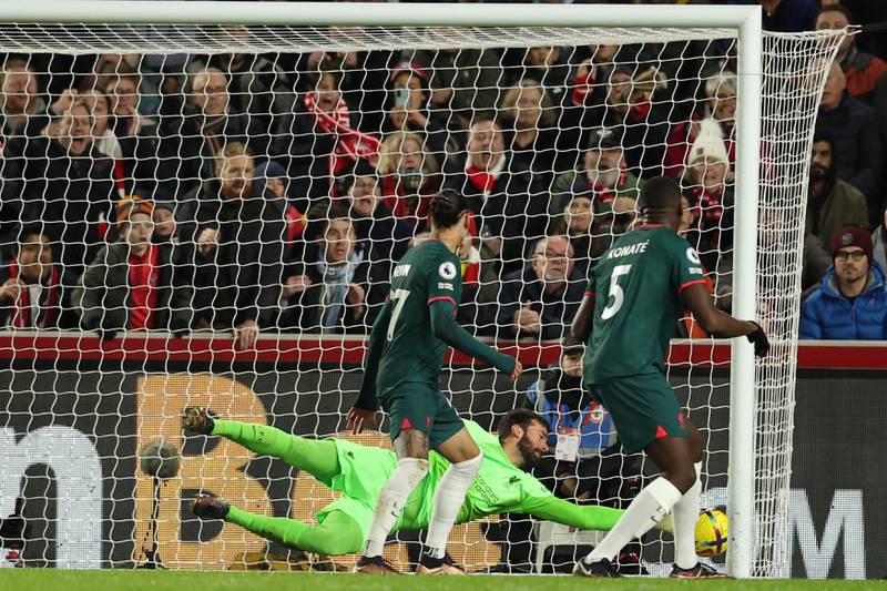Liverpool goalkeeper Alisson Becker cannot stop Ibrahima Konate scoring an own goal. AFP