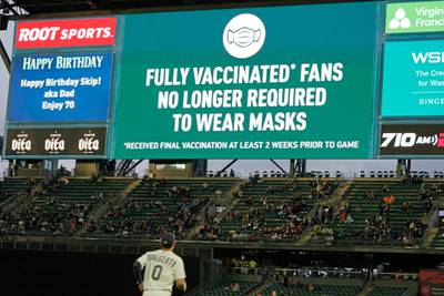 Fans sit in a special section for people who are fully vaccinated against Covid-19, at T-Mobile Park in Seattle. AP 