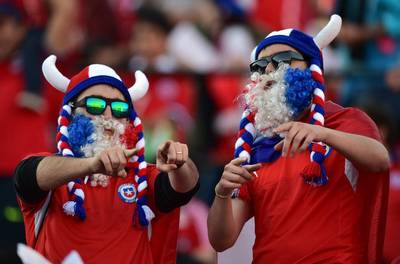Supporters of Chile wait for the start of the 2018 World Cup qualifying match in Santiago on Thursday between hosts Chile and Colombia. Martin Bernetti / AFP